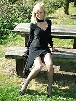 Beautiful Laura is outside and showing off her nylon stockings and high heels